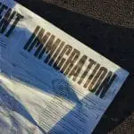 "Immigration" printed on a white newspaper.