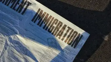 "Immigration" printed on a white newspaper.