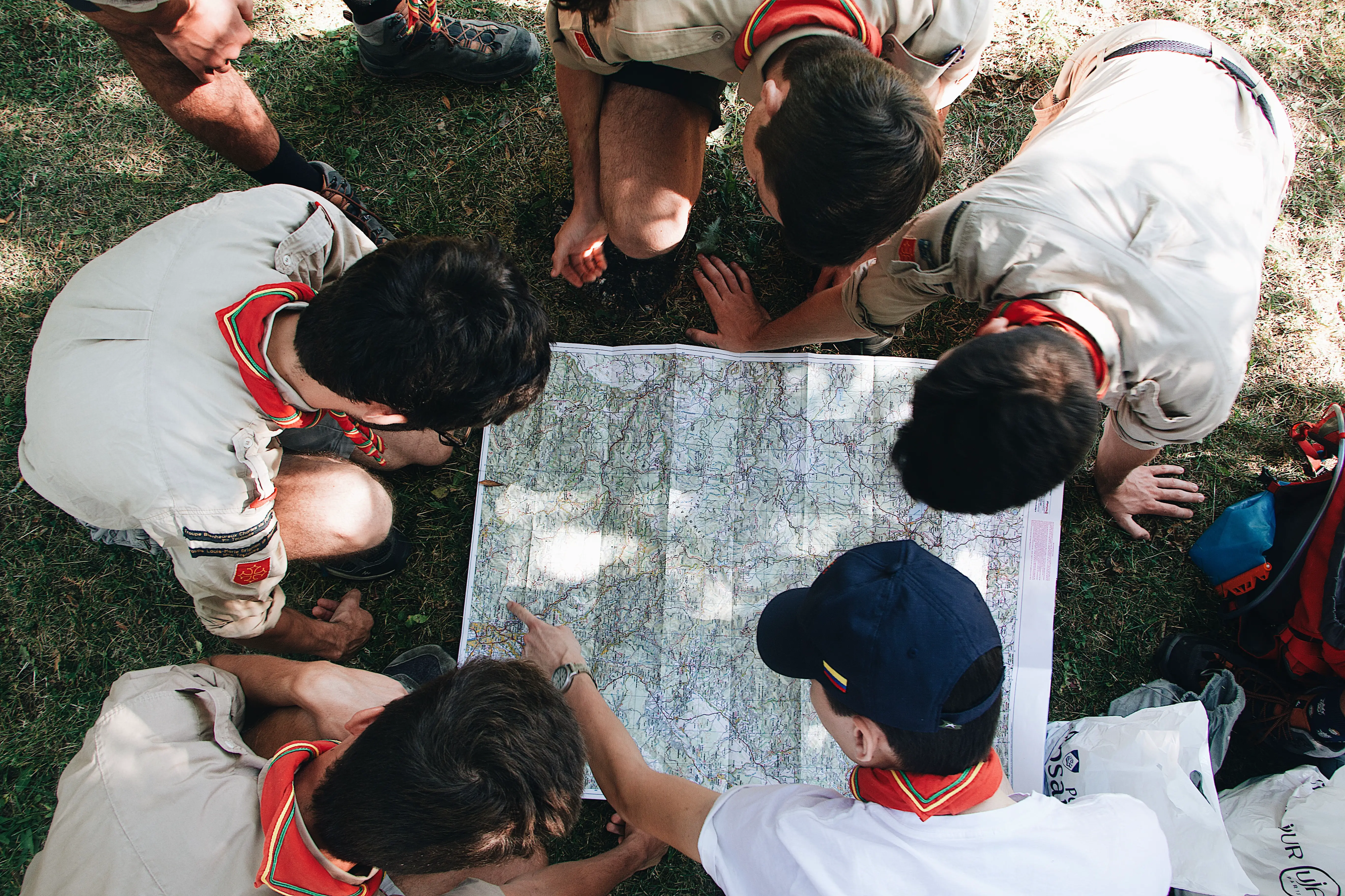 A Group of Boy Scouts Reading a Map