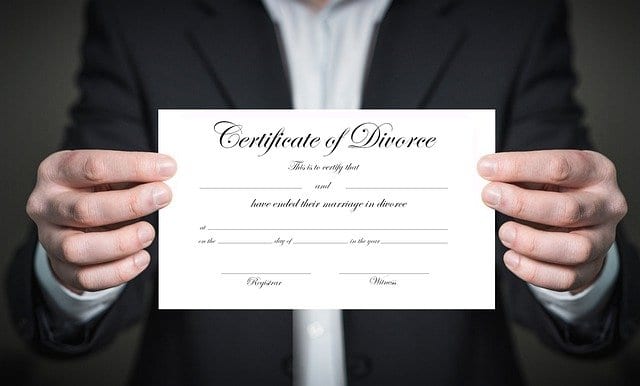 Man holding a divorce certificate